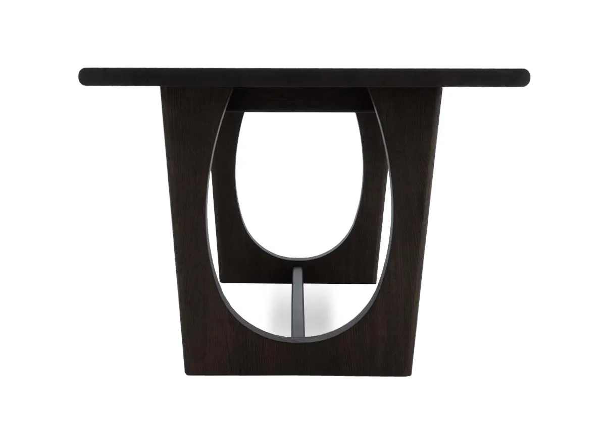 A dark brown oak dining table from EZ Livings Flow range.Side view of o shaped frame