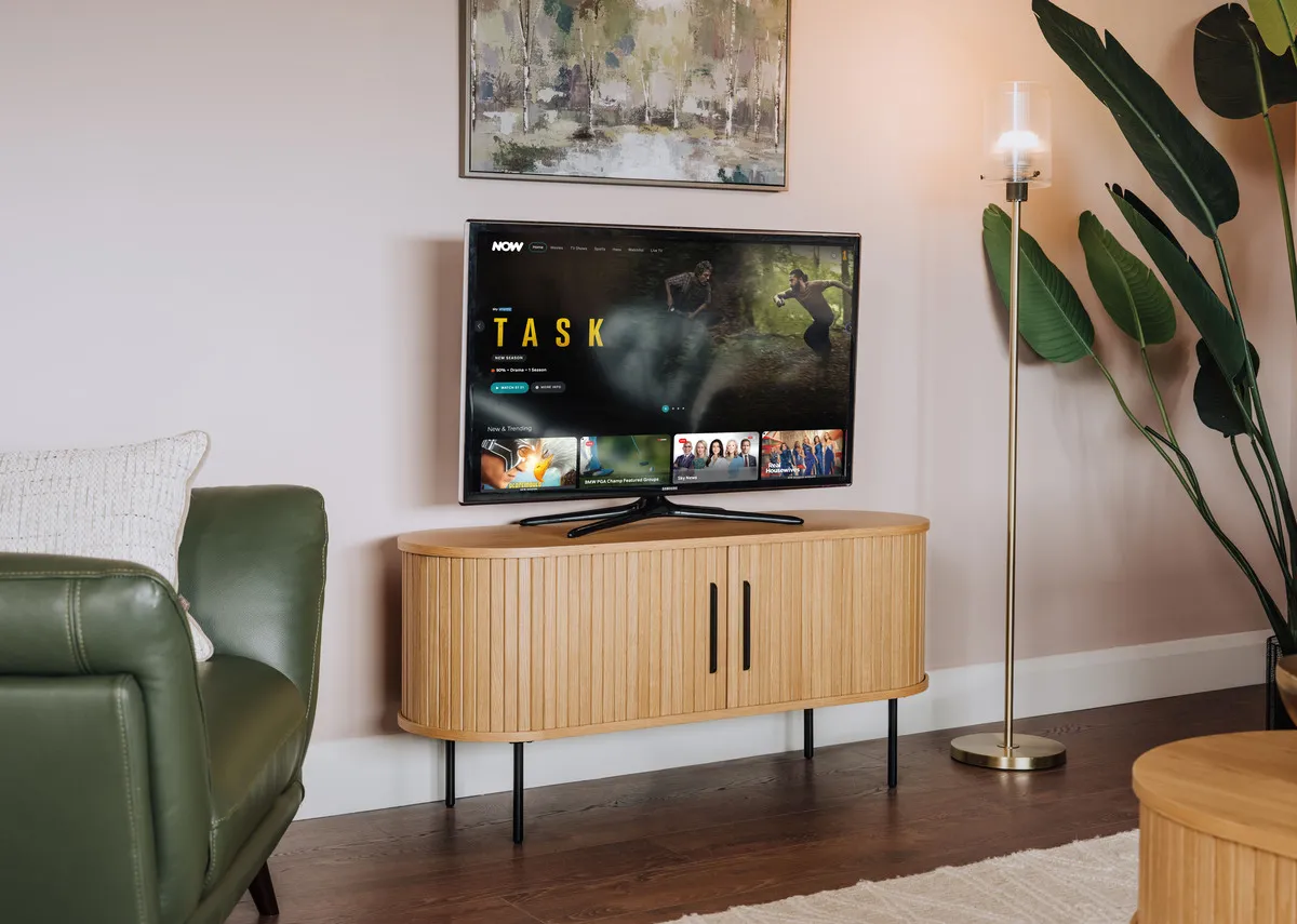 A lifestyle image of the Nola TV Unit with tv