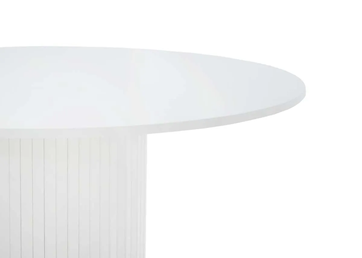 A close up view of the white round dining tables smooth top and the vertical fluted design of its cylindrical base.