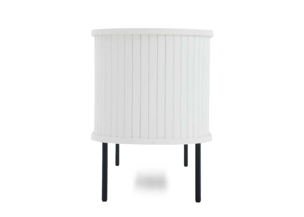 A white tambour cabinet with vertical slats and black legs shown from a narrow end.