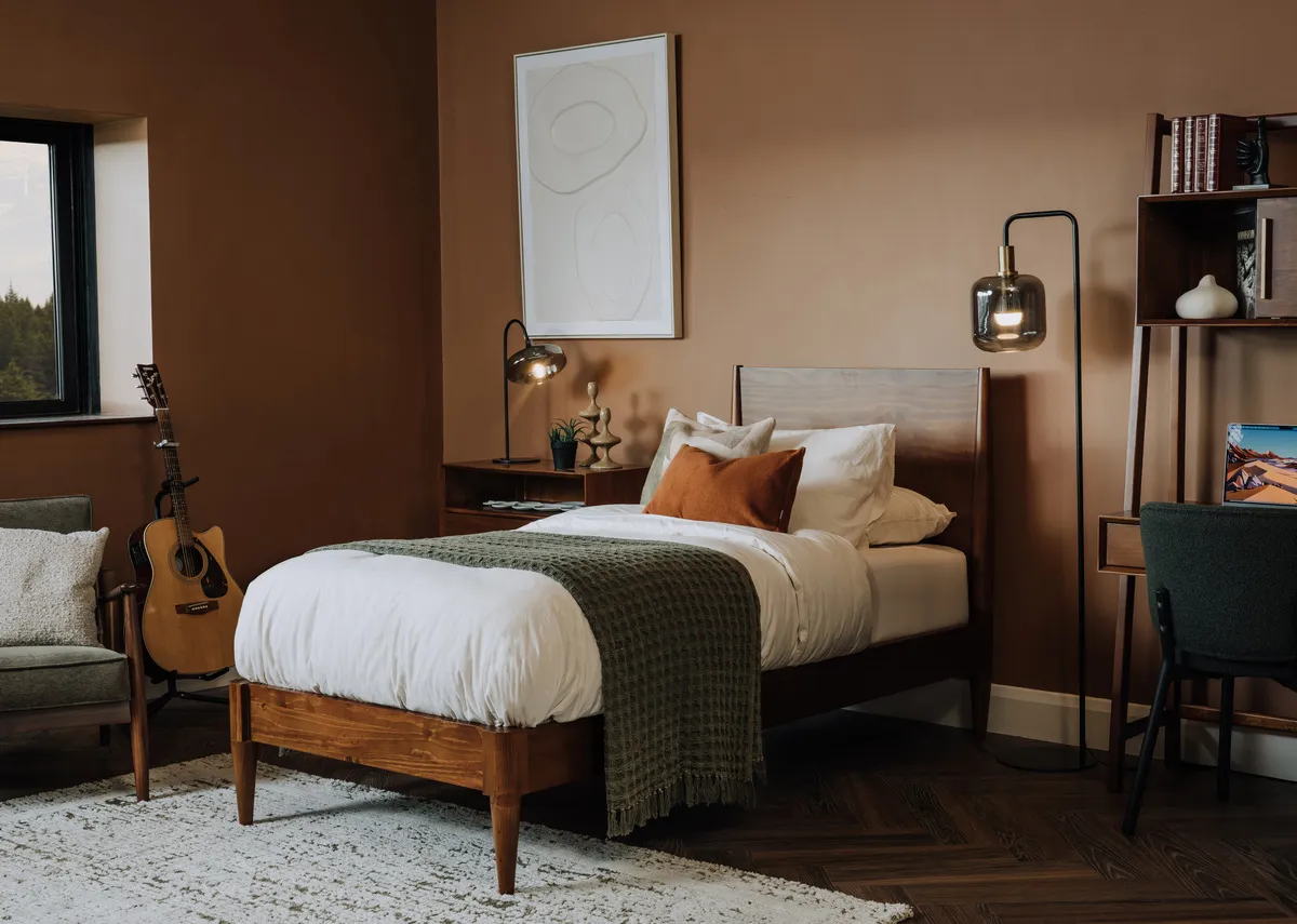 A lifestyle image of the Leya bedframe with Lekar floor lamp and Gateway canvas