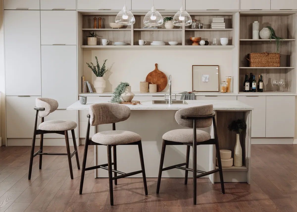 A lifestyle image of the Hazel stools around a breakfast island counter