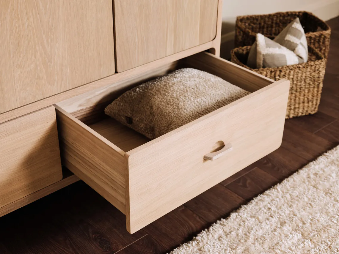 A lifestyle image of the Jay wardrobe with drawer open.