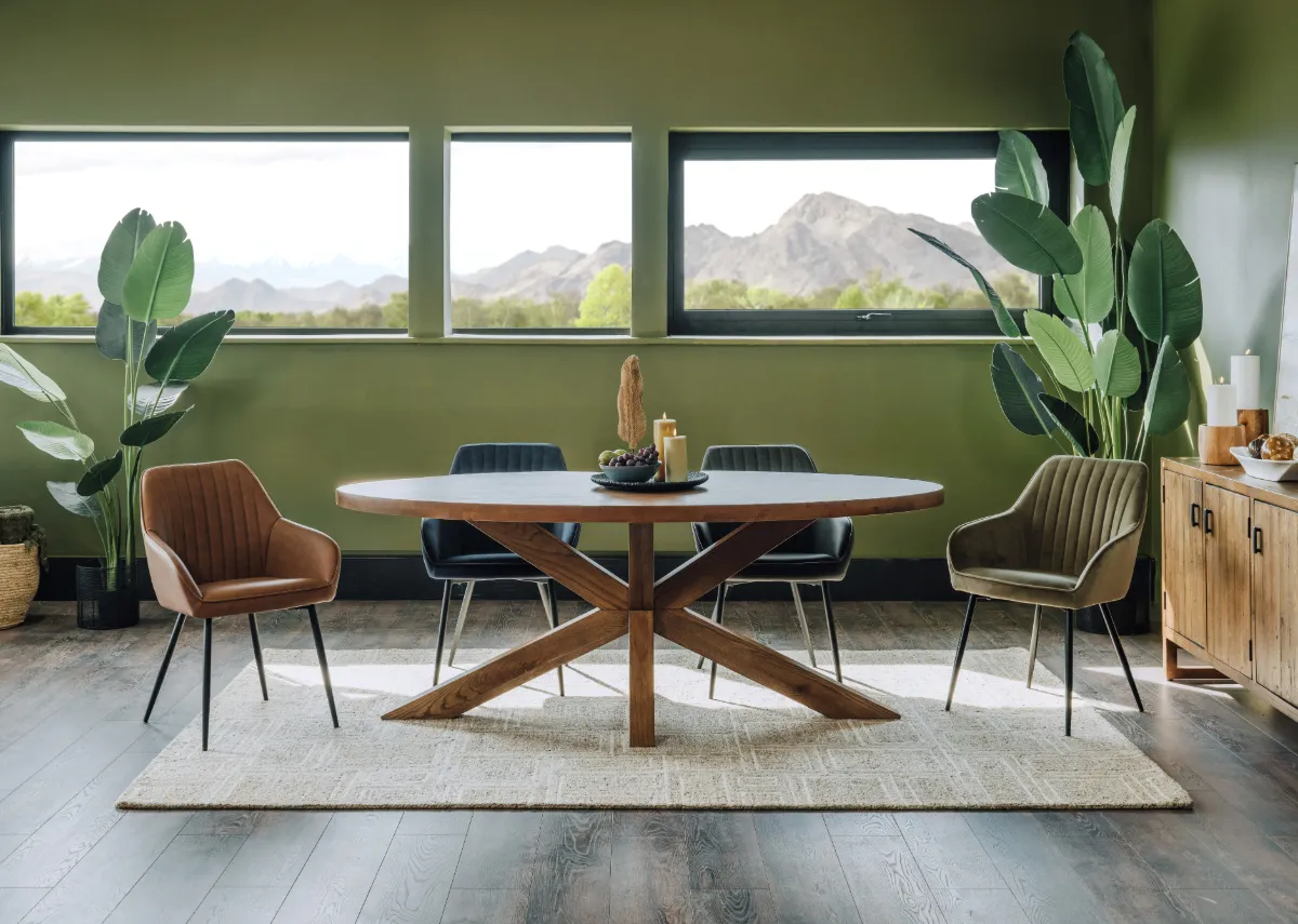 A lifestyle image of the Oslo table with Nolan chairs in all colors and Memphis rug.