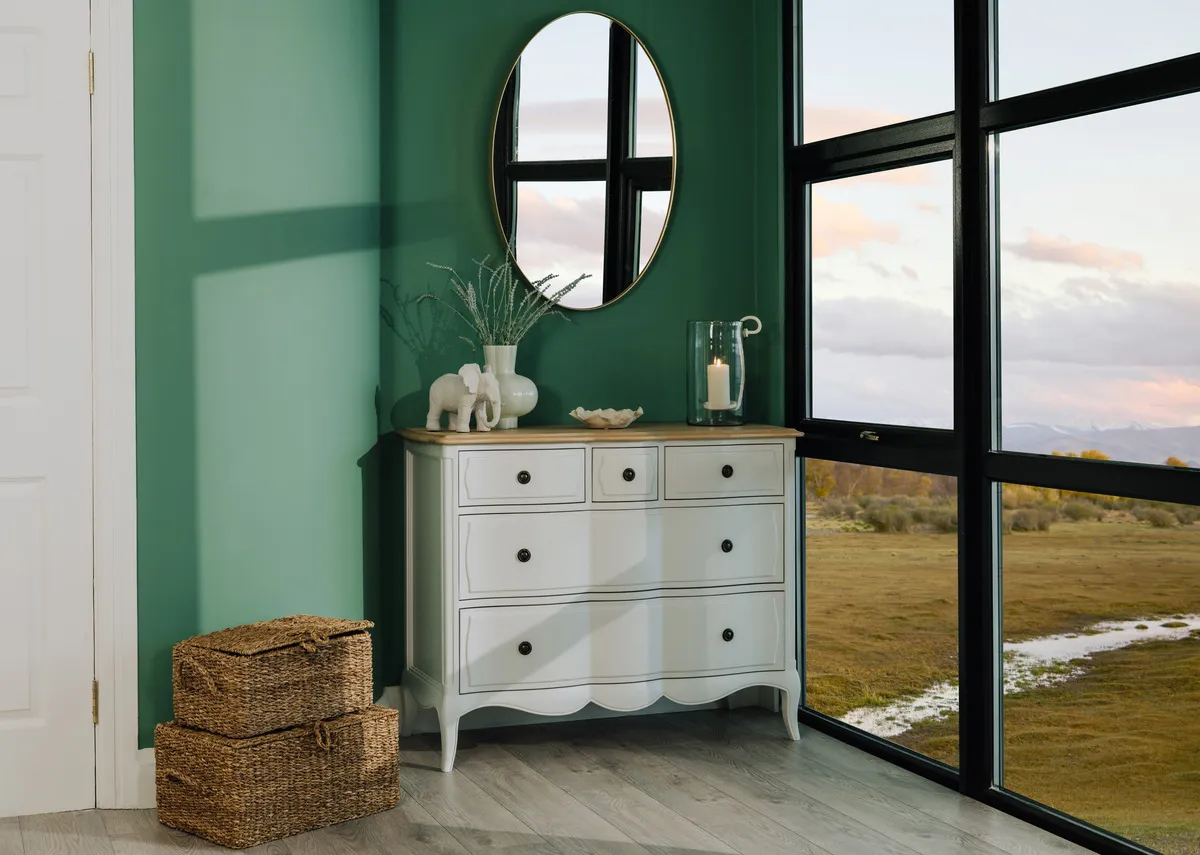 A lifetsyle image of the Amelie chest with elling mirror and Ariel baskets.