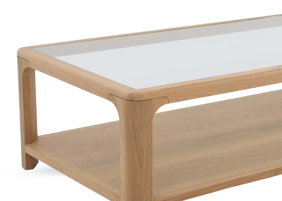 An oak coffee table with glass top and lower shelf from EZ Livings Gus range. Closeup of wood texture