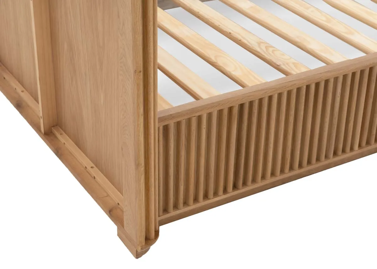 A natural oak bedframe with slatted base and headboard from EZ Livings Bradley range.Closeup of slatted base detail