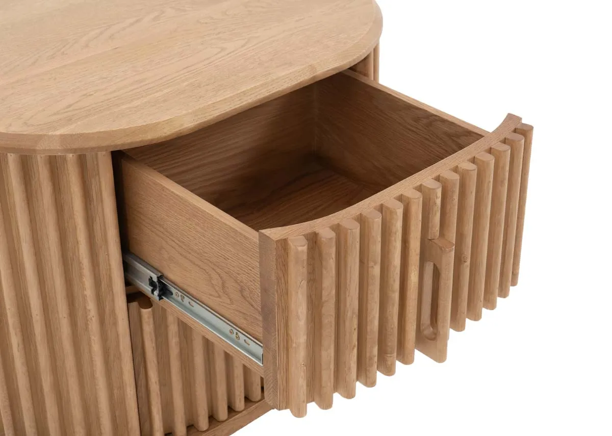 An oak locker with curved edges and slatted fascia from EZ Livings Bradley range.Closeup of soft close drawer
