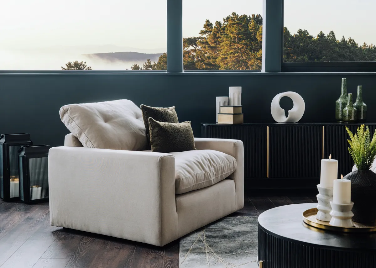 A lifestyle image of the Cozy cuddler with the Rego coffee table.