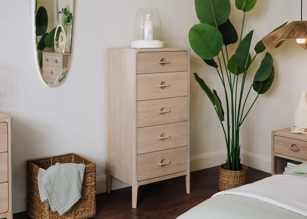 A lifestyle image of the Jay tallboy with Carnation candle holder and the Calathea plant