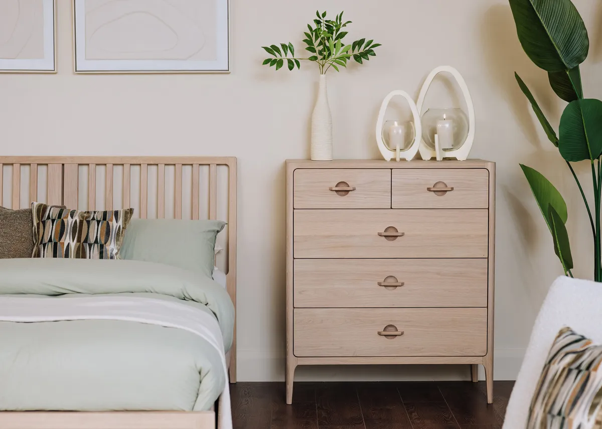 A lifestyle image of the Jay chest with Kimora candle holders