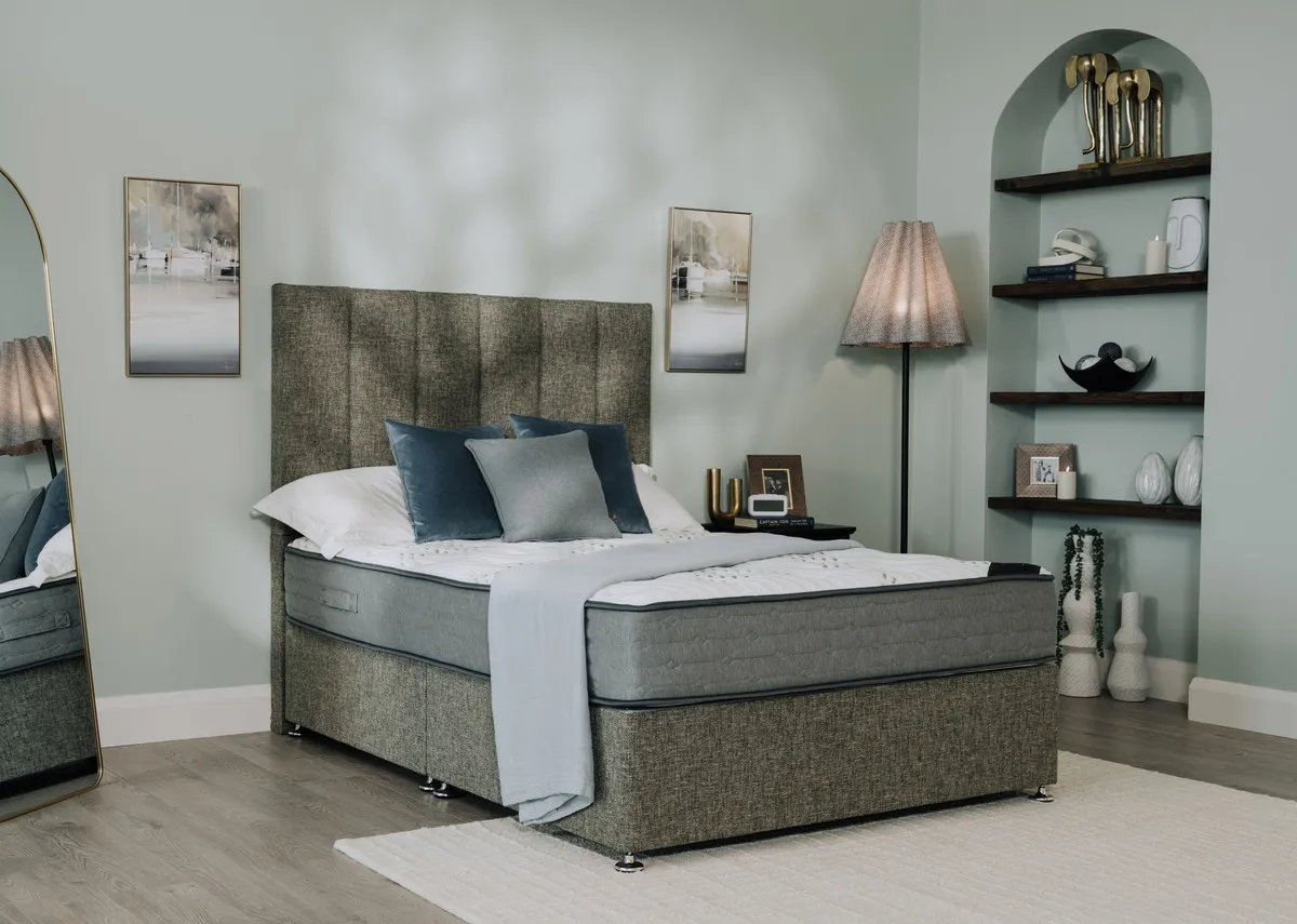 A lifestyle image of a Divan bed with Executive opulence mattress with Washington lamp and vance mirror.