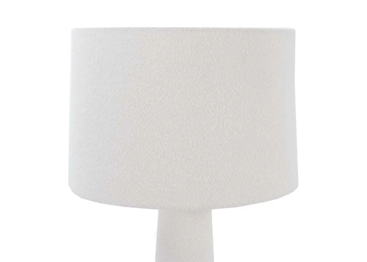 A white floor lamp with boucle shade from EZ Livings Tullow range. Closeup of boucle shade