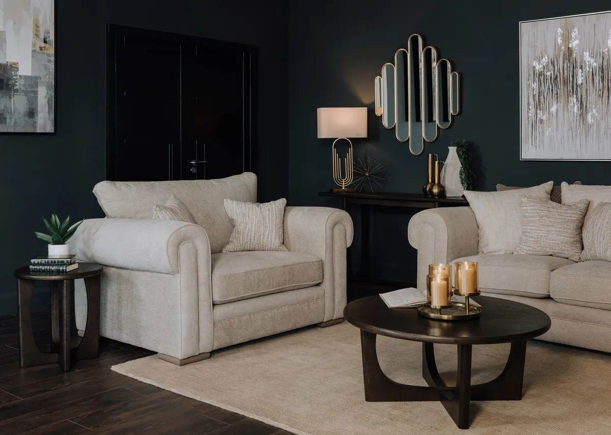 A lifetsyle image of the Olivia hb cuddler withFlow cofefe table and side table.