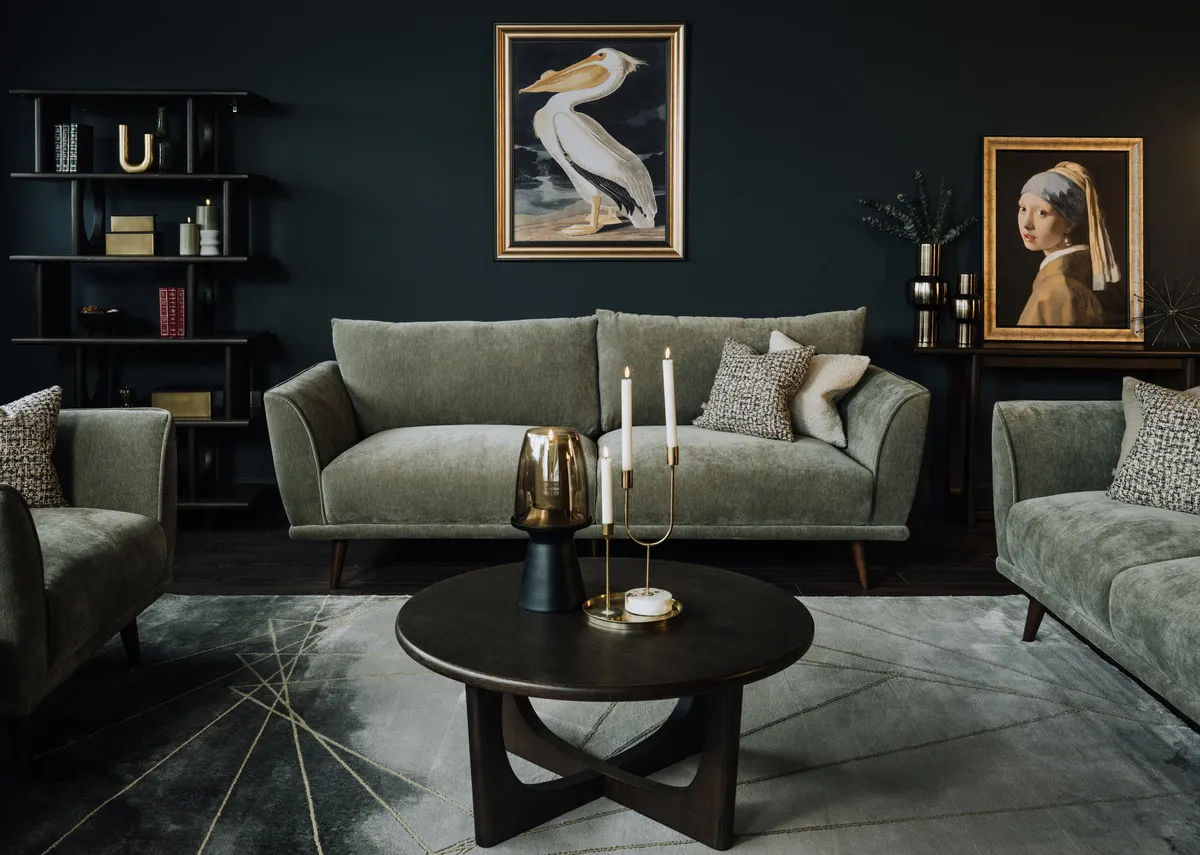 A lifestyle image of the Boutique sofa range with Flow  table and Pelican and Girl with a pearl canvas