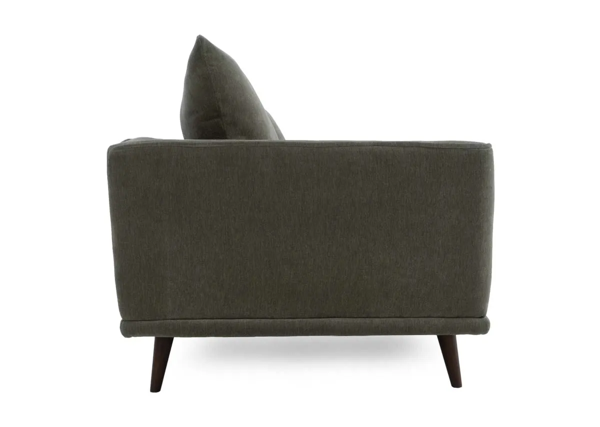 Four seater sofa in olive green fabric showing the side profile with the armrest and flared back cushion.