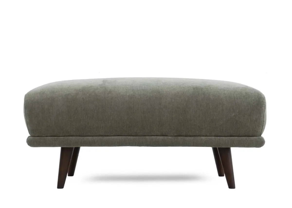 Large footstool in olive green fabric presented from a straight on front view.
