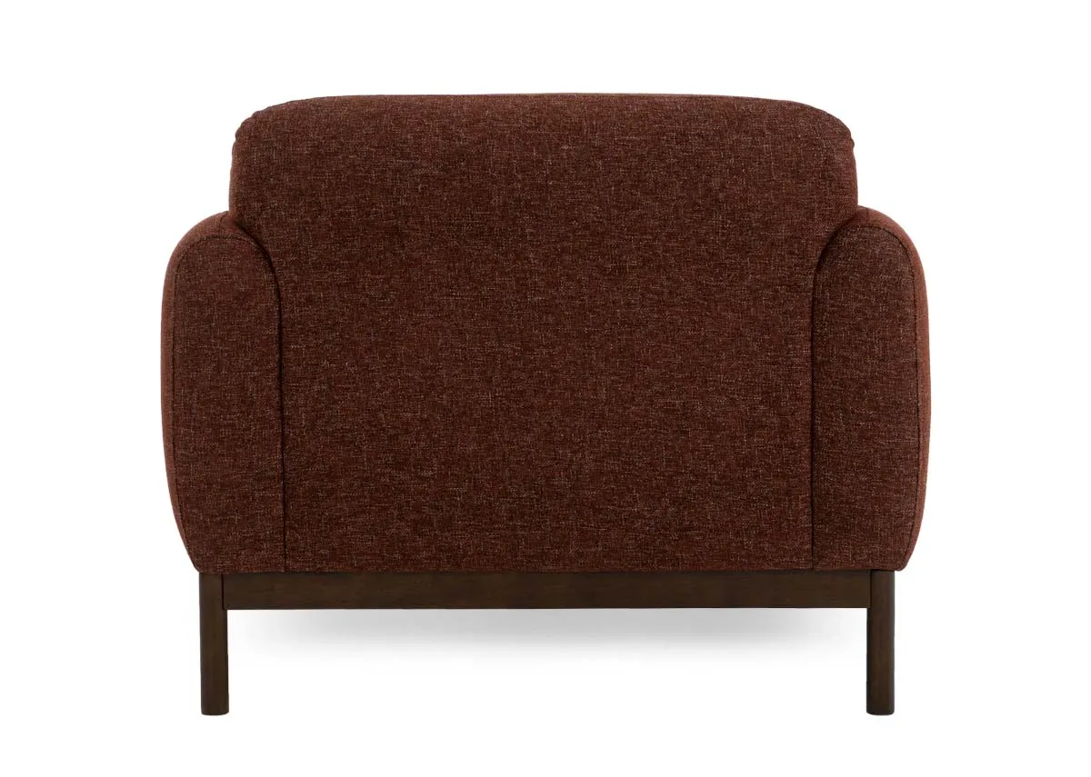 A brick rust fabric armchair from EZ Livings Loft range. Back view