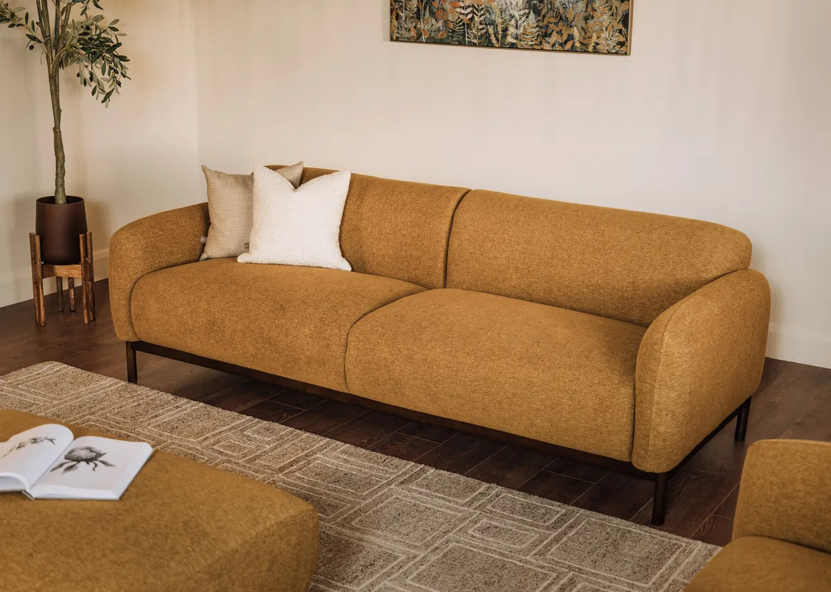 A lifetsyle image of the Loft gold sofa with Fanciful canvas.