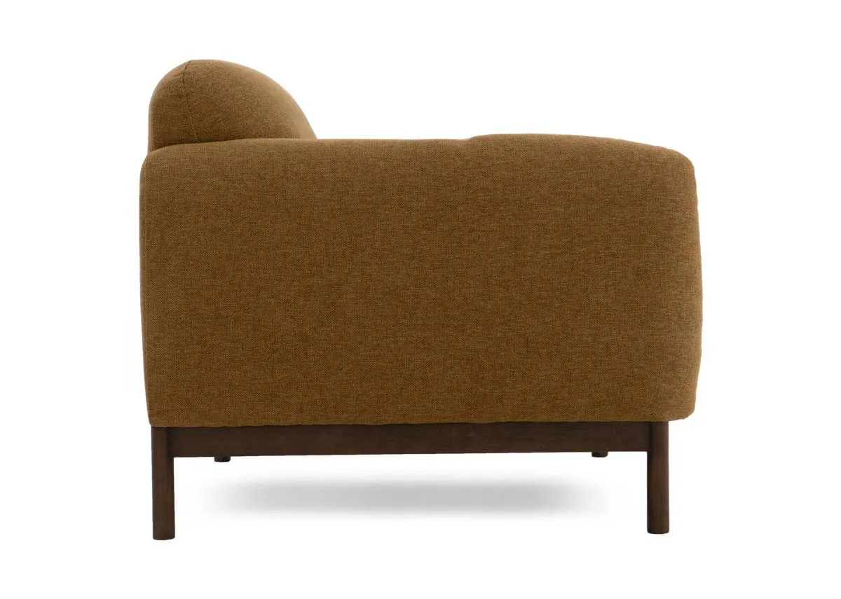 A gold mustard fabric armchair from EZ Livings Loft range.Side view of low armrest