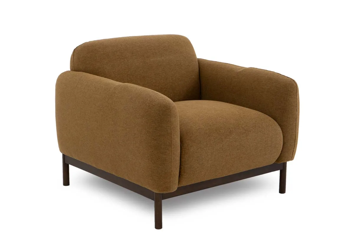 A gold mustard fabric armchair from EZ Livings Loft range. Angled veiw of sofa with low arms and bacj