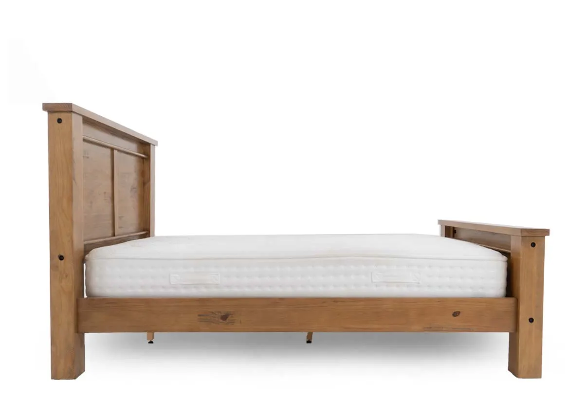 Dimensions for a light brown wooden 6ft bedframe measuring 125 cm high 203 cm wide and 232 cm long.