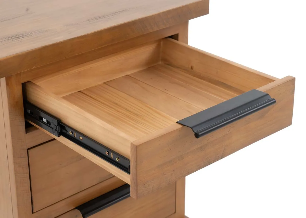 A close up of an open drawer in a light brown wooden bedside locker showing the metal runners and the wooden interior.