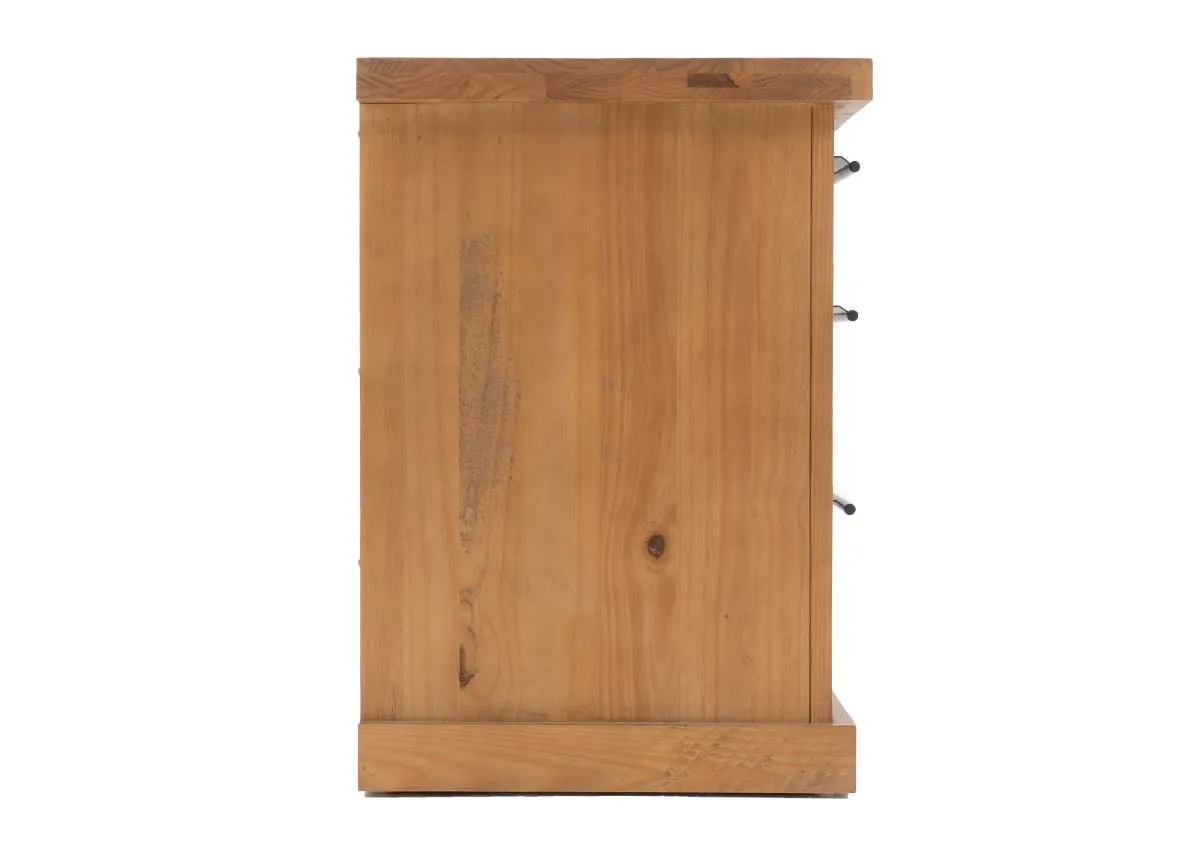 A side view of a light brown wooden bedside locker with three black handled drawers on the right side.