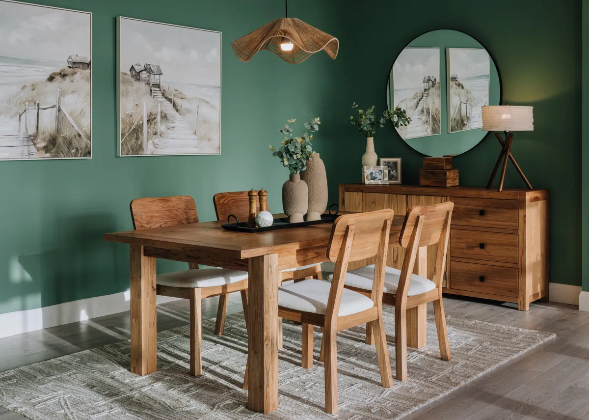 A lifestyle image of the Outback dining table fixed with matching dining chairs & sideboard with Journey canvas