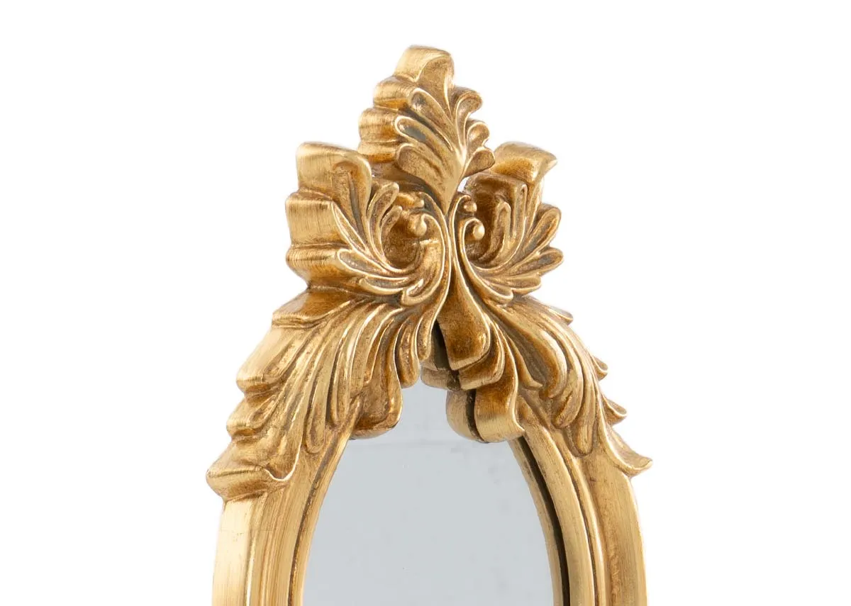 A long slim oval framed mirror with ornate detail in gold from EZ Livings Julieta range.Closeup of ornate frame detail