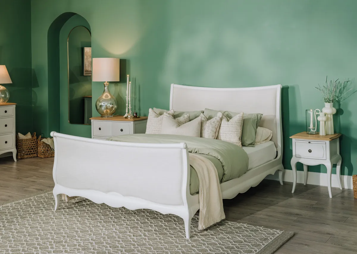 A lifestyle image of the Amelie bedframe with locker small and large with heiny rug.