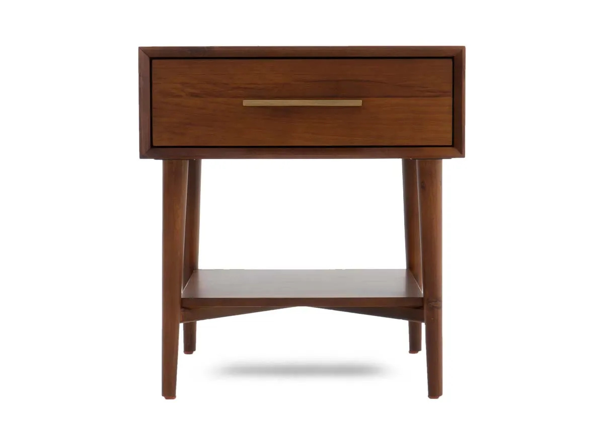 A dark pine lamp table with one drawer an open storage shelf and four tapered legs viewed from the front.