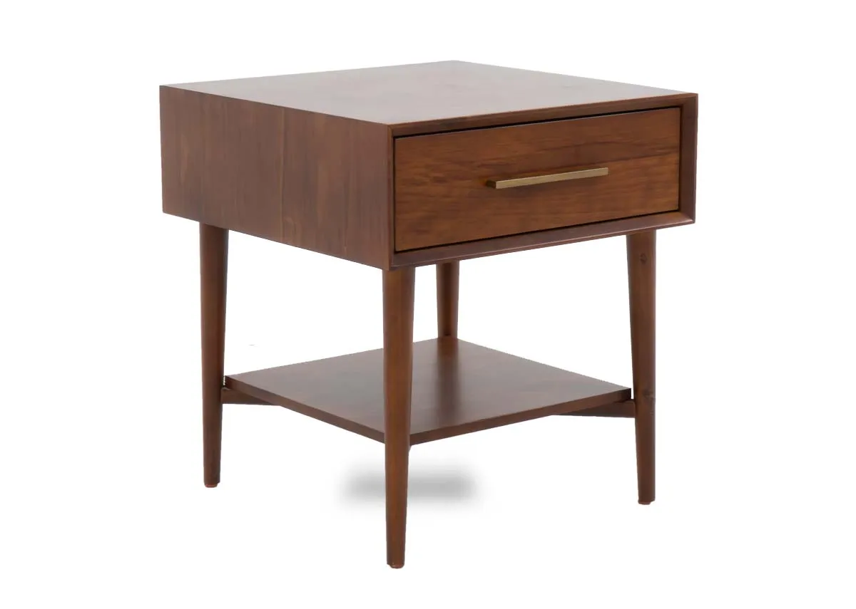 A dark pine lamp table with a single drawer and an open lower shelf supported by four tapered legs.