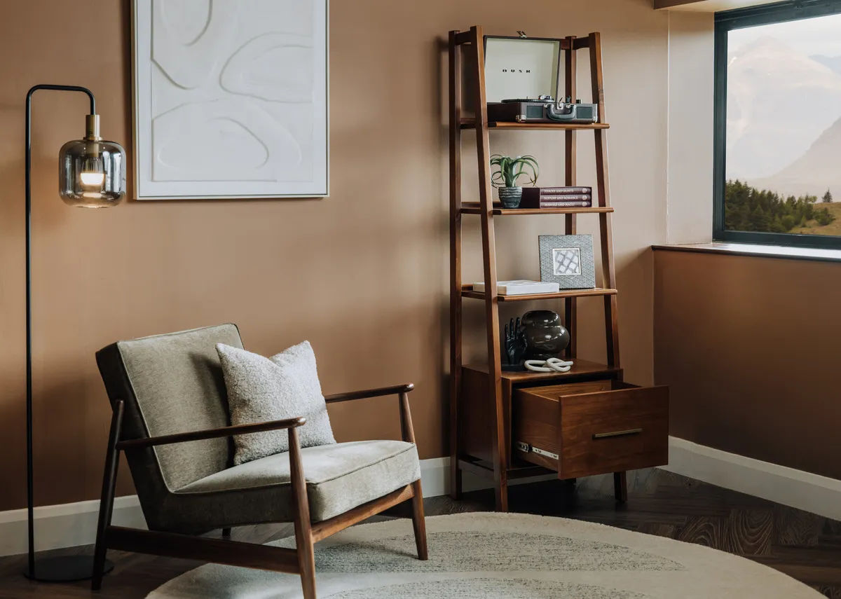 A lifestyle image of the Jordan armchair with a Leya display unit with bottom drawer open.