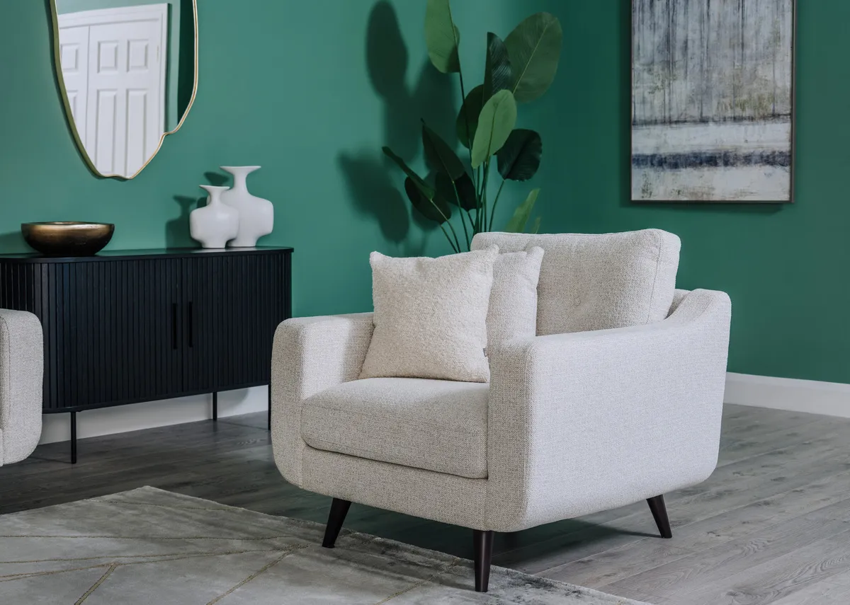 A lifestyle image of the Bandon armchair with nola sideboard wih Benton mirror.