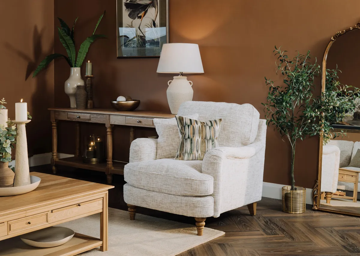A lifetsyle image of the Lismore armchair with console and coffee table.