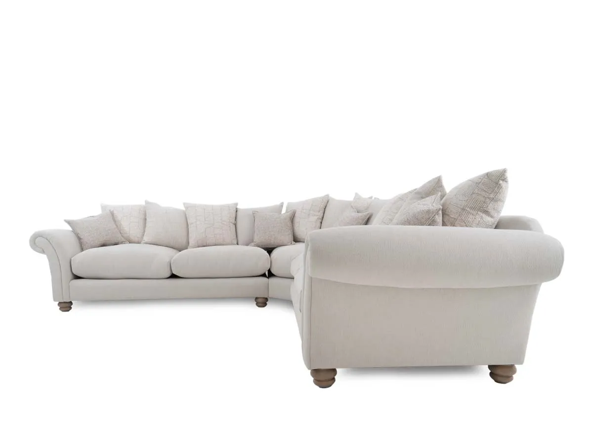 An extra large cream fabric pillowback corner sofa from EZ Livings Paloma range. Back view