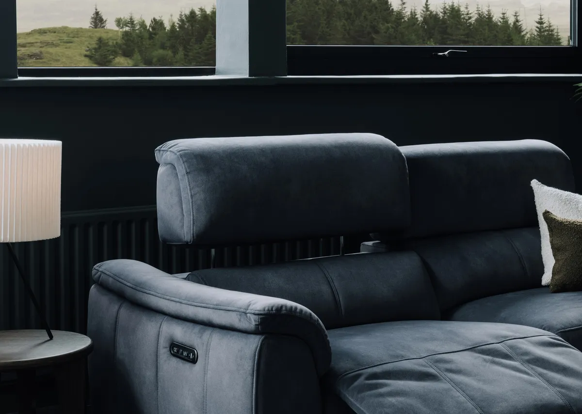 A dark grey 2 seater power recliner from EZ Livings Madsion range.Front view of sofa fixed