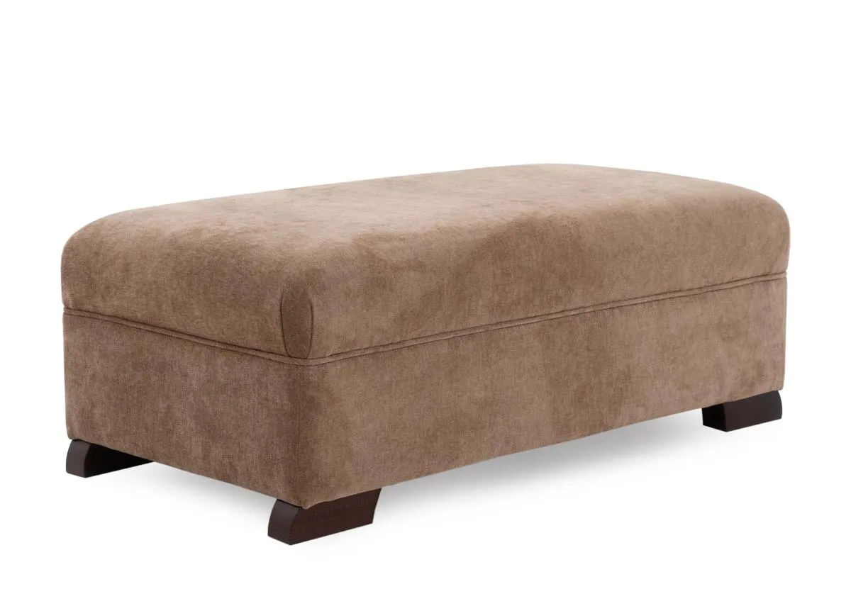 A gold fabric rectangular footstool from EZ Livings Kilronan range. Angled view of dark feet and high cushion top.