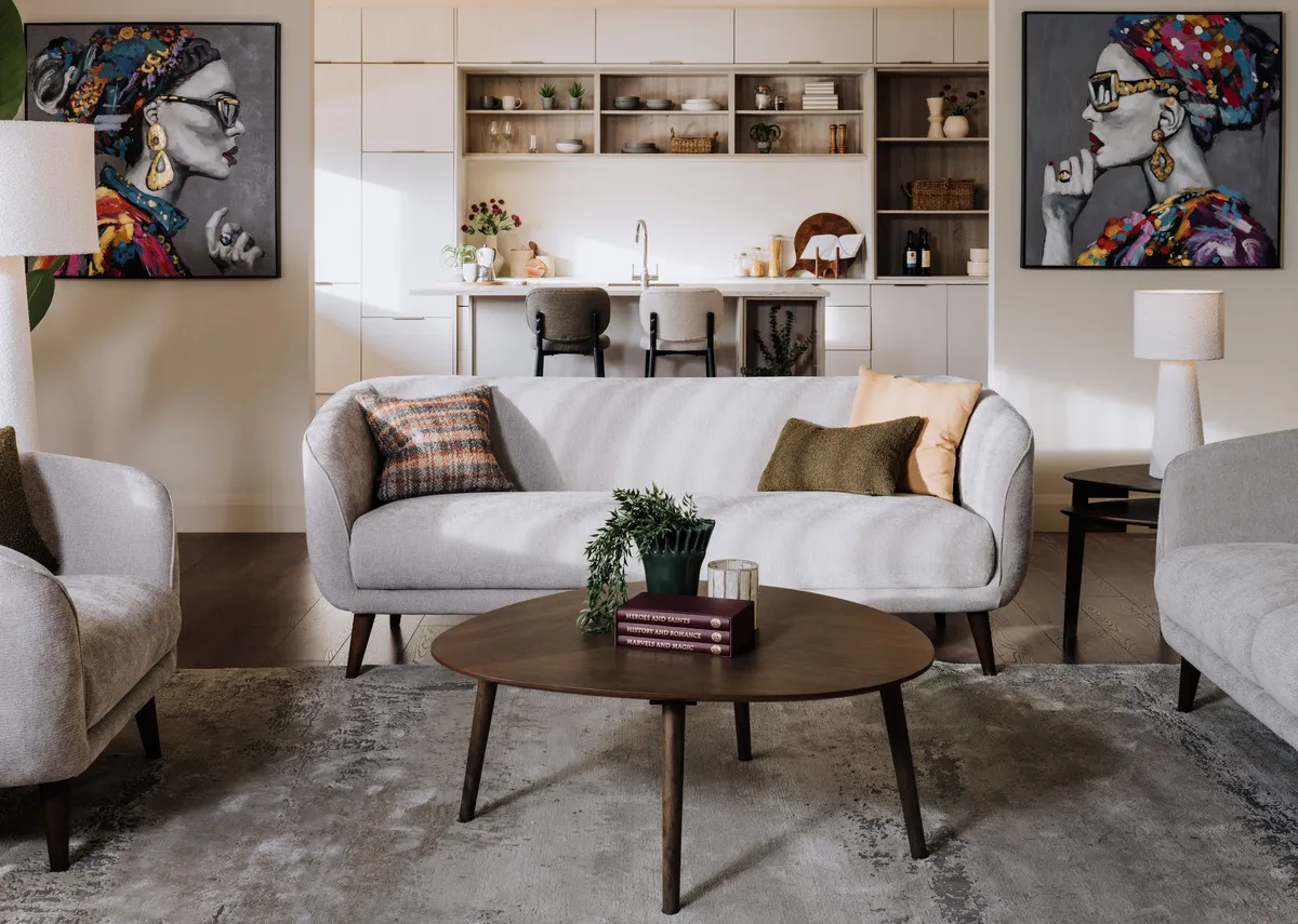 A lifestyle image of the Amber silver sofas with Sonoma table with Barriro vase with plant.
