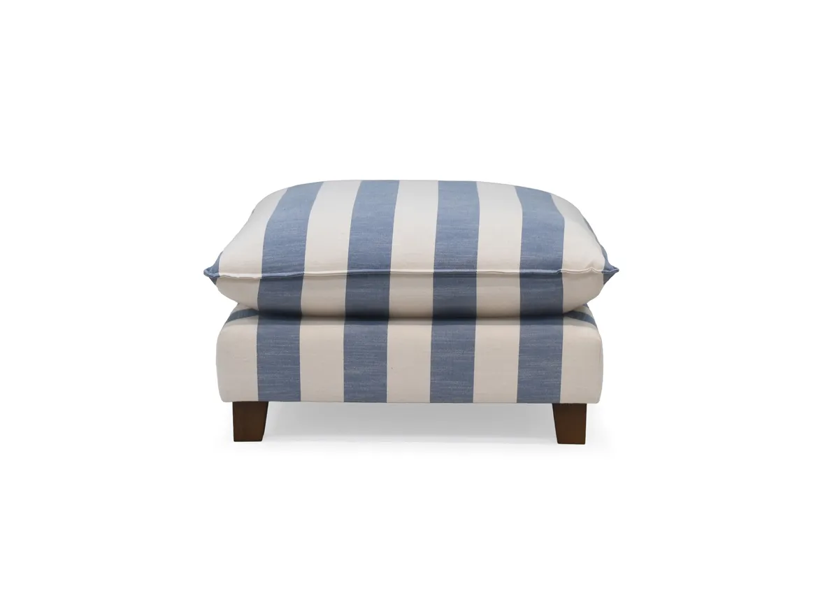 A blue & white stripe fabric footstool from EZ Livings Howth range. Front view of foam padded seat.