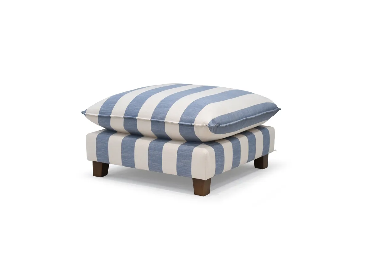 A blue & white stripe fabric footstool from EZ Livings Howth range. Angled view.