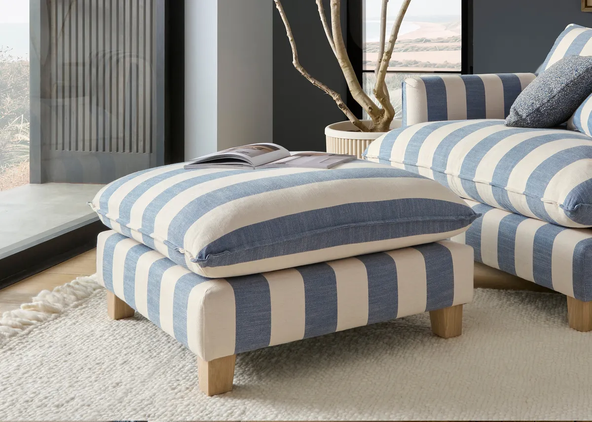 A lifestyle image of the Howth stripe footstool with foam seat and matching cuddler from the Vogue Range.