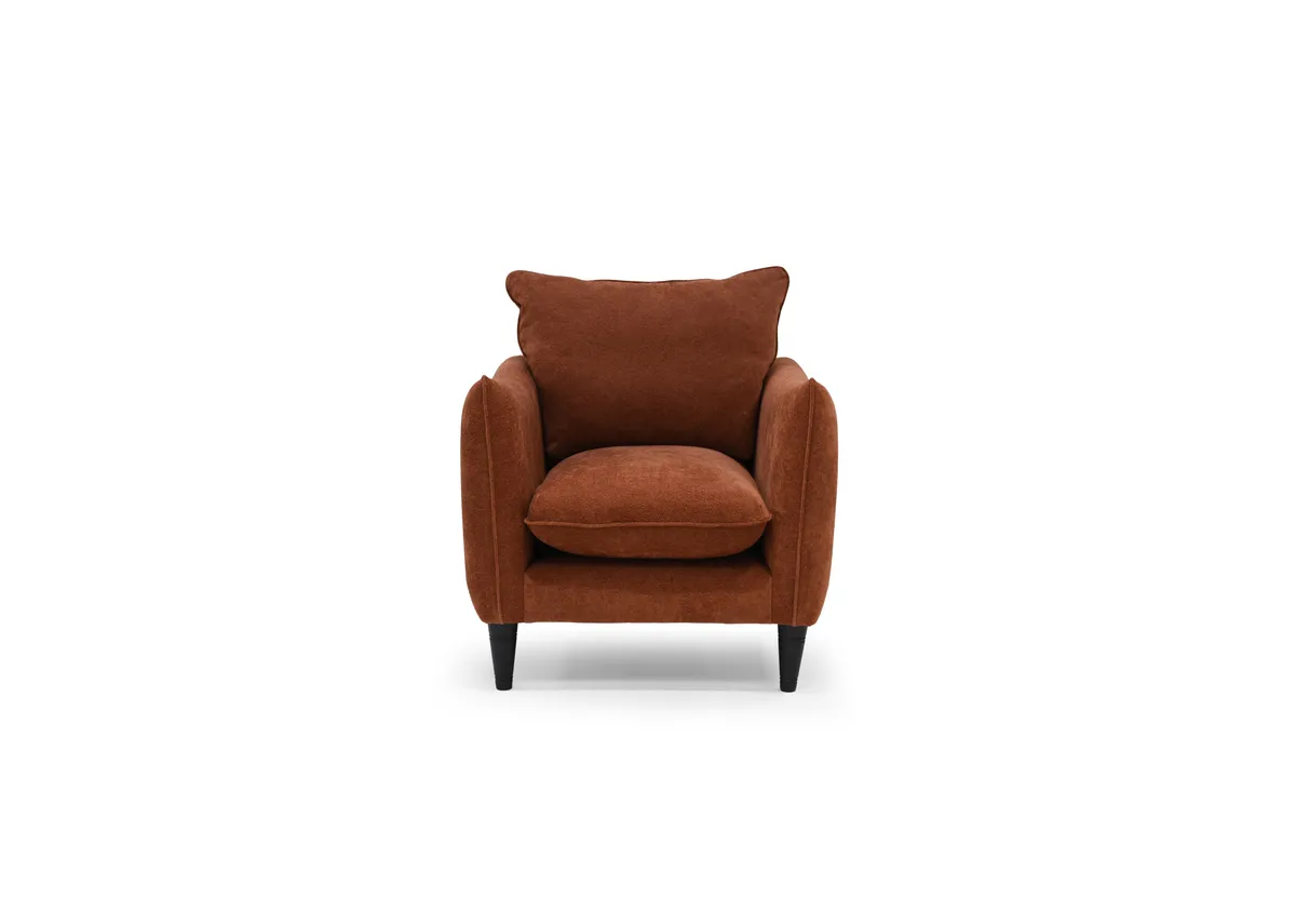 A rust boucle armchair from EZ Living Furnitures Kenmare range.Front view
