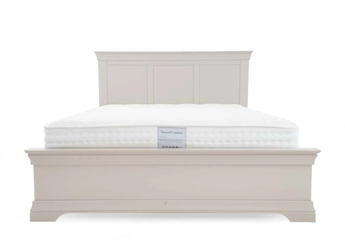 A taupe grey bed from EZ Livings Dove range. View of high panelled headboard and footboard.