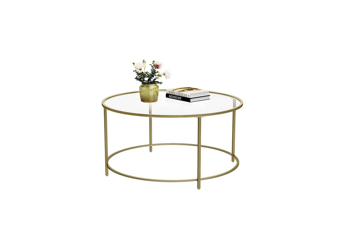 A round gold coffee table with glass top from EZ Livings Forge range.
