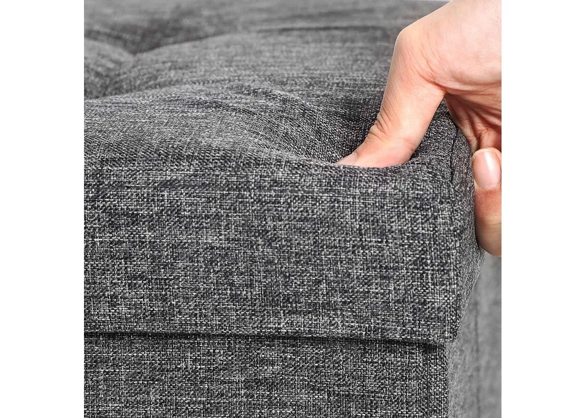 A grey fabric ottoman from EZ Livings Kickers range. A Closeup of fabric