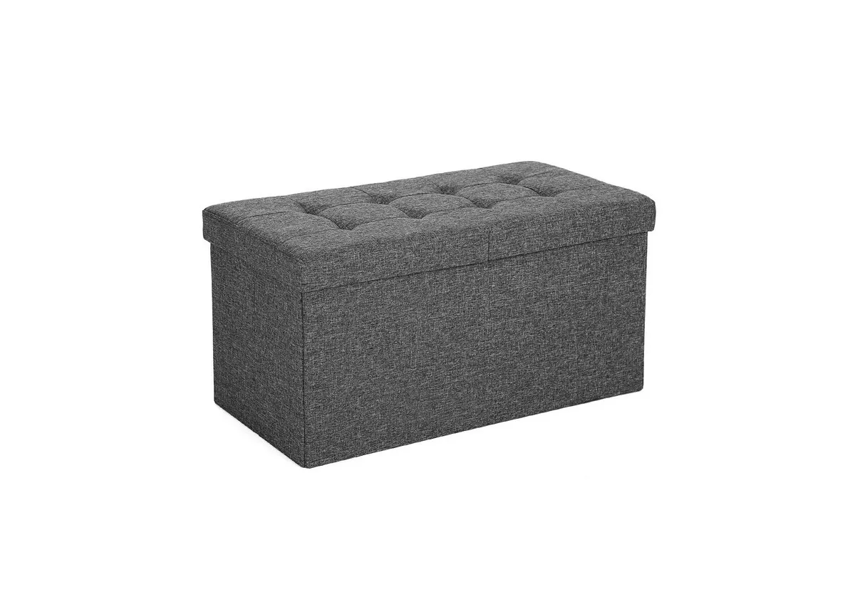 A grey fabric ottoman from EZ Livings Kickers range. Angled view