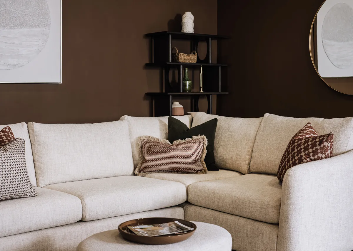 A cream boucle large rhf corner sofa with 6 scatters from EZ Livings Carnaby range. Back view of warrantied frame.