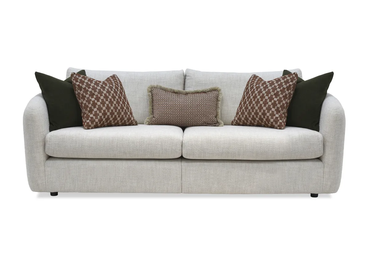 A beige fabric 4 seater sofa from EZ Livings Carnaby range.Front view of 4 scatters and 1 boslter cushion